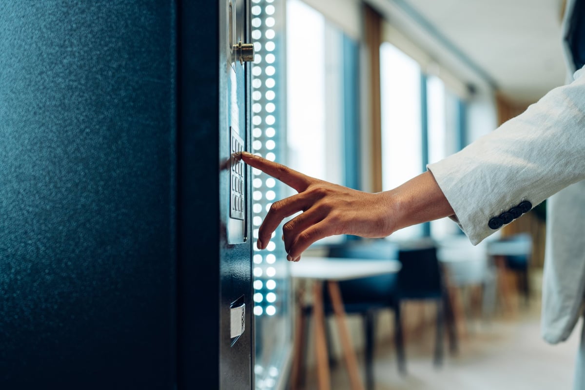 Person selecting items at a vending machine