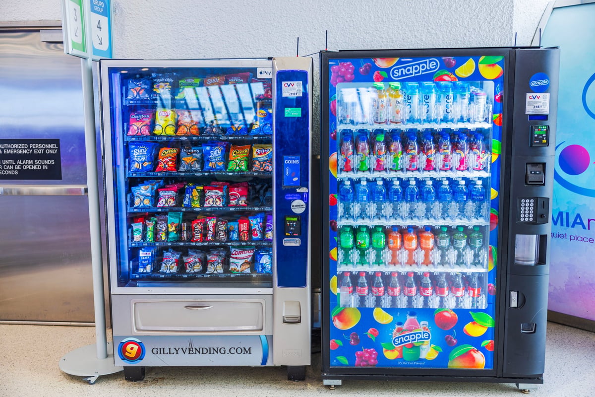 Modern vending machines stocked with snacks and drinks