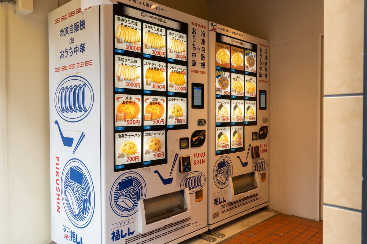A modern automated vending kiosk stocked with products